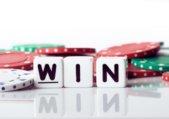 The word "WIN" spelled with white dice in front of colorful casino chips, symbolizing rewards and the concept of How Do Casino Bonuses Work.